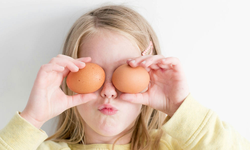 Girl Holding Two Eggs